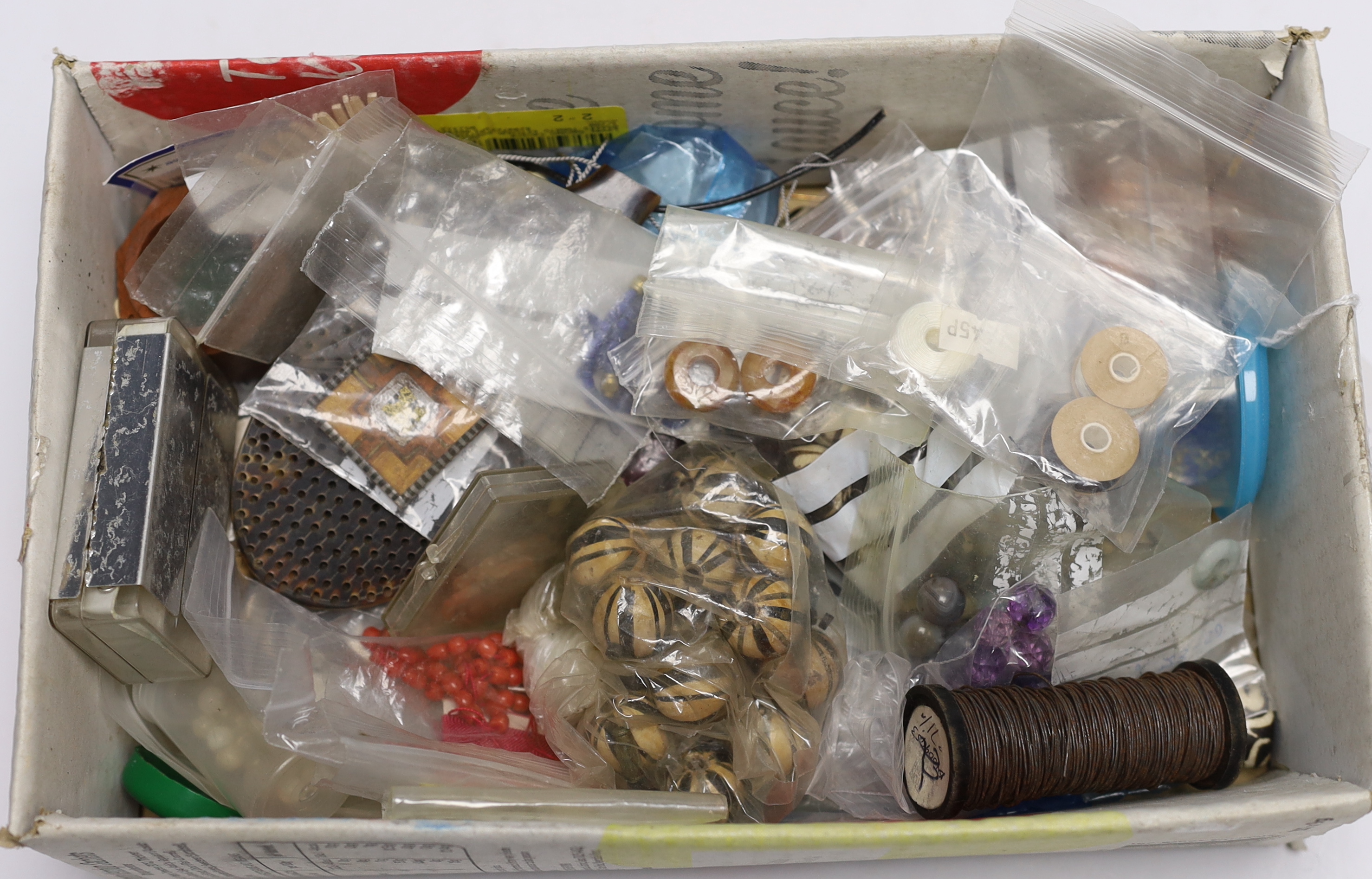 A quantity of assorted jewellery related items including loose beads, bolt rings, thread, copper wire, agate stones, etc.